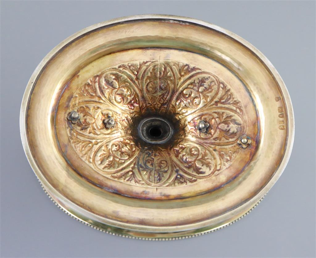 A handsome pair of Victorian parcel gilt silver oval comports by Hunt & Roskell (lacking glass bowls),